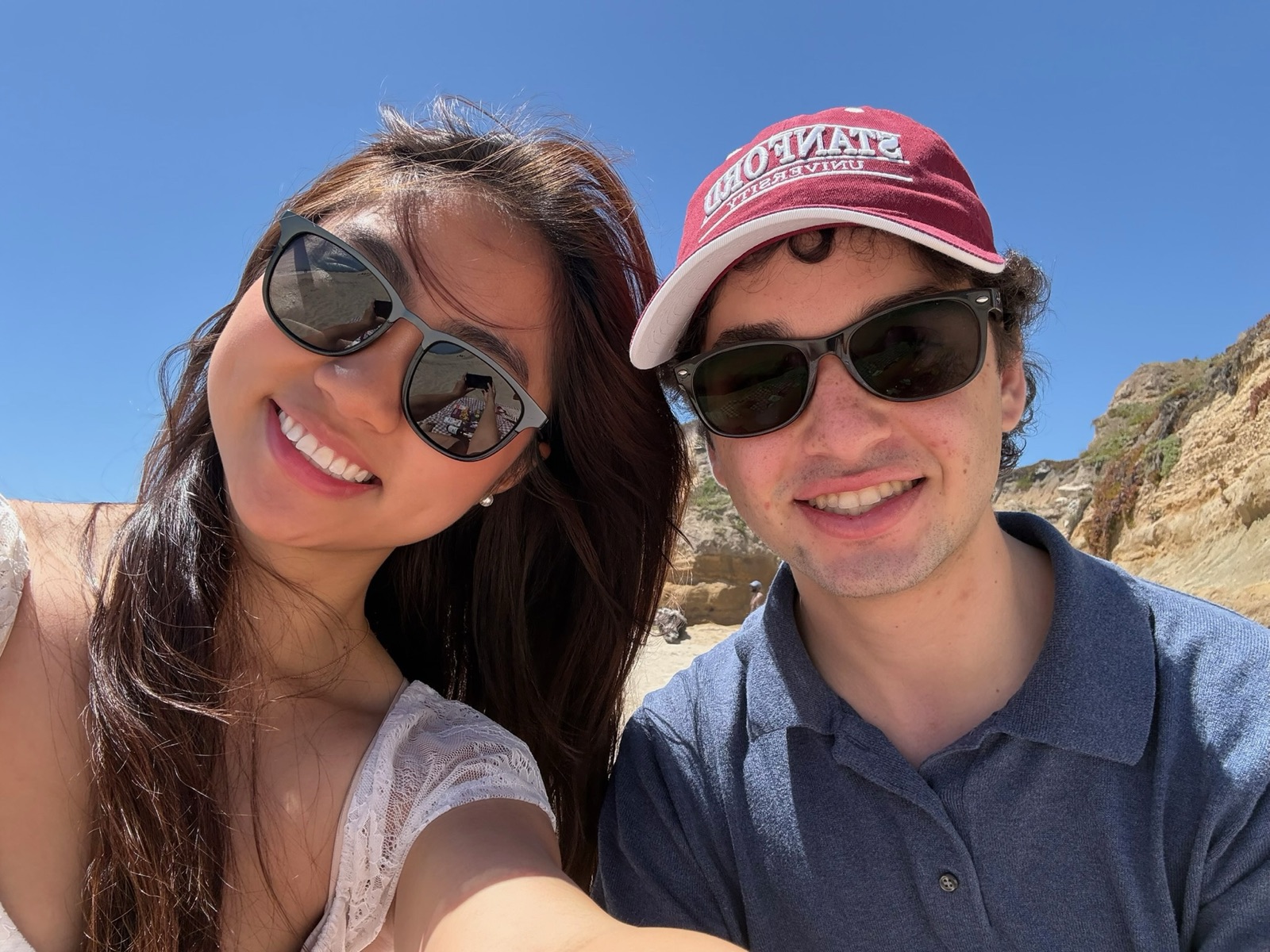 Noah and Faith at the beach wearing sunglasses